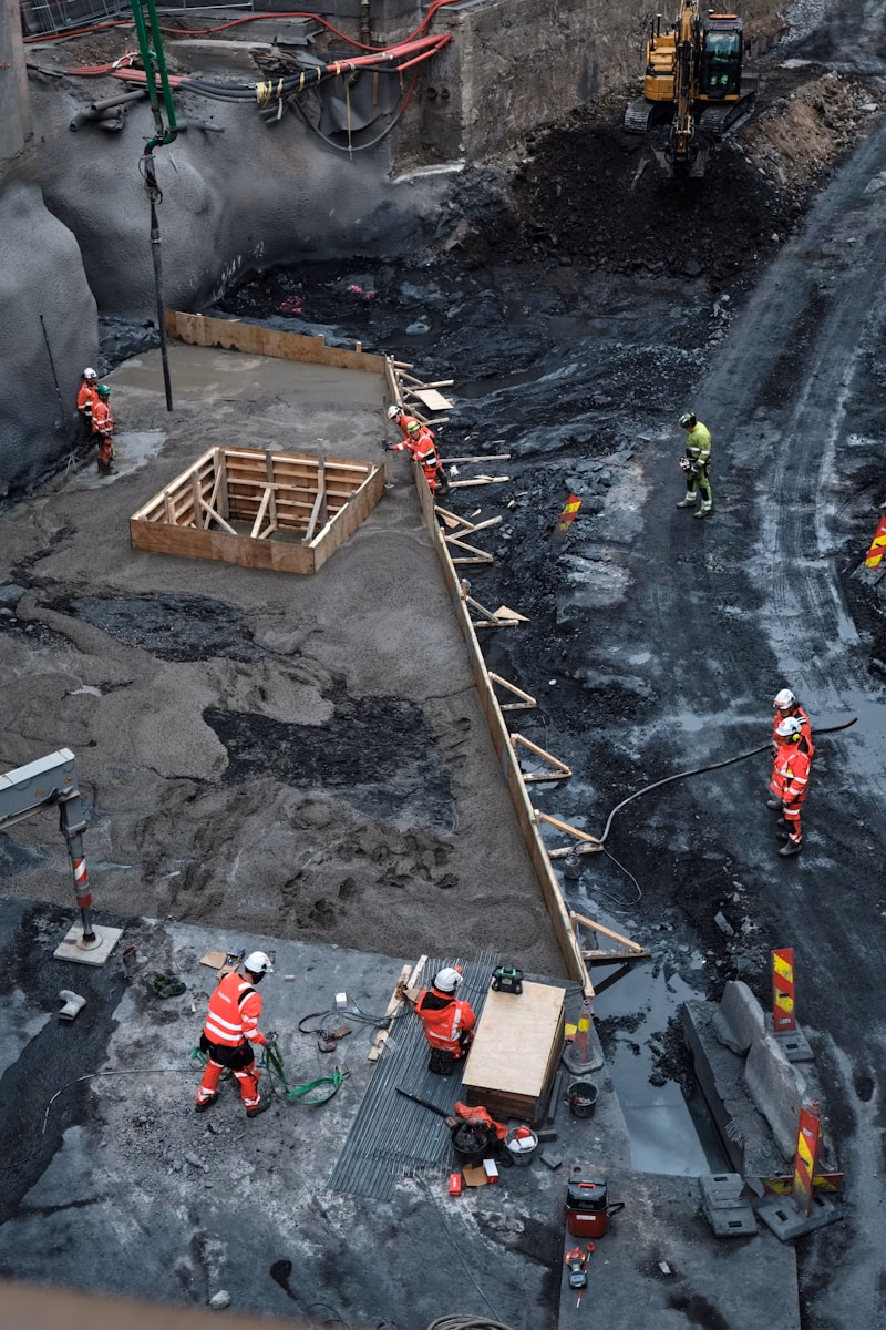 Construction workers building a large foundation