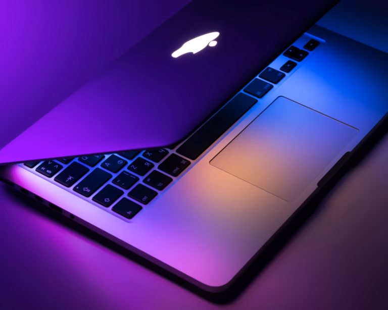 slightly opened silver MacBook